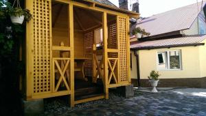 a screened in porch of a house at Apartments like hotel in Chernivtsi