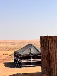 a tent in the middle of the desert at Night Stars Camp in Bidiyah