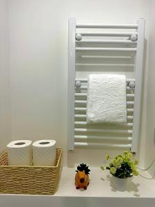 a bathroom with two rolls of toilet paper on a counter at Stylish Ensuit Studios in the Heart of Vibrant Tooting 1 Min to Tube in London