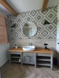 a bathroom with a sink and a mirror at Willa Widokowe Wzgórze in Falsztyn +18 photos