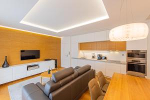 a large living room with a couch and a table at Apartmán Silvie Luhačovice in Luhačovice