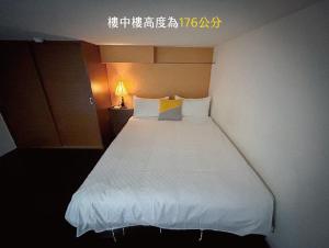 Katil atau katil-katil dalam bilik di 小牧湯泉民宿