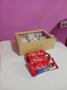 a box of coca cola and a box of chips at Apartman IN Pančevo in Pančevo
