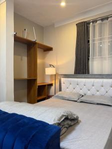 Postel nebo postele na pokoji v ubytování Serenity suites, Ntinda