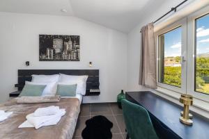 a bedroom with a large bed and a window at Villa Zorka in Staševica +26 photos
