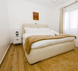 Postel nebo postele na pokoji v ubytování Keplyn Homes - Tatu City