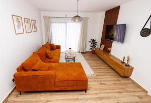 Posezení v ubytování Keplyn Homes - Tatu City + 15 fotografií