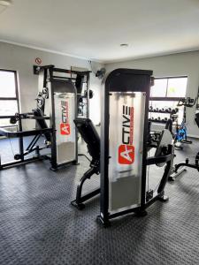 a gym with two treadmills and tread machines at Urban Contempo Lush in Fourways