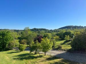 a view of a garden with trees and bushes at Glencross Cottage in Rathmullan