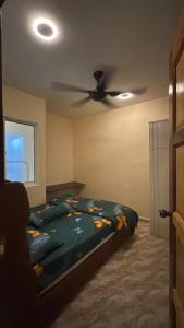 Katil atau katil-katil dalam bilik di Easy Homestay +4 gambar