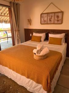 En eller flere senge i et værelse på Lounge Vila Tatajuba