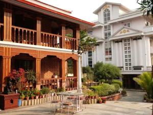 a building with tables and chairs in front of it at Star Valley Hotel in Kathmandu