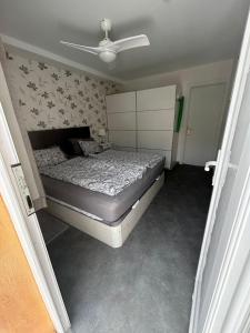 a bedroom with a bed and a ceiling fan at Granada I Apartment 11 - Patalavaca in Patalavaca