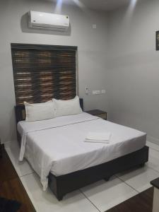 Ένα ή περισσότερα κρεβάτια σε δωμάτιο στο Havence Villas - Kottakkal