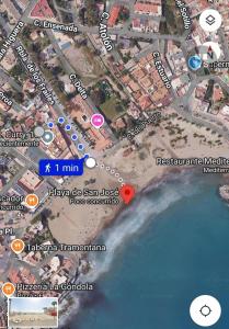 a map of the beach with a red heart at Casa mis Nietas in San José