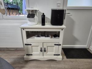 a white table with a blender on top of it at Au cœur des Bois in Amboise +8 photos