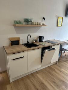 Η κουζίνα ή μικρή κουζίνα στο Wiejski Raj- Apartamenty