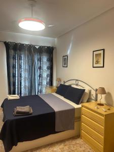 Ένα ή περισσότερα κρεβάτια σε δωμάτιο στο Maria Apartment Cabo Roig