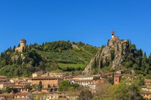 a town on top of a mountain with two towers at Villa delle rose Brisighella in Brisighella +30 photos