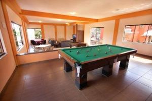 a living room with a pool table in it at Pousada Recanto in Pirenópolis