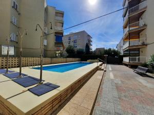 a swimming pool in the middle of a building at Apartment Del Sol with SEA views in Salou