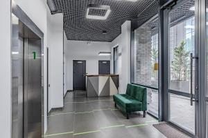 an office hallway with a green chair and a desk at Green Line in Kyiv