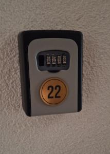 a remote control on a wall with the number on it at Vila Zvončica, apartman Puzović 22 in Kopaonik +5 photos