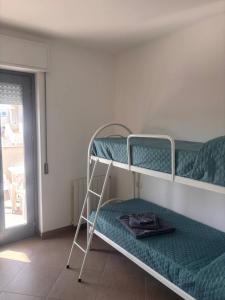 En eller flere senge i et værelse på Casa Angela