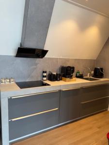 a kitchen with a sink and a counter top at IL Mulino House D in Ons Belang