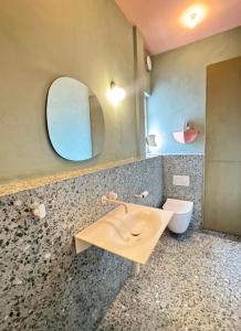a bathroom with a sink and a mirror and a toilet at Sky & Sea - Ramsgate in Ramsgate +13 photos