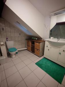 a bathroom with a sink and a toilet and a sink at Nice studio in Paris suburbs in Épinay-sur-Seine