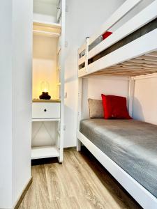 a bedroom with a bunk bed and a staircase at Le Dimore di Giove in Bevagna