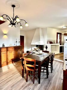 a kitchen and dining room with a table and chairs at Le Dimore di Giove in Bevagna +50 photos