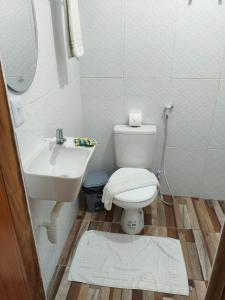 a bathroom with a toilet and a sink at Pousada Massayó in Maceió +63 photos