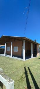 a house with a roof on top of it at Casa na Praia da Pinheira in Palhoça