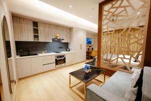 a living room with a couch and a table at Galaxy Blue Sapphire Studio in Ghaziabad