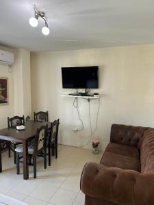 a living room with a couch and a table at House Pravilovic apartments in Cetinje