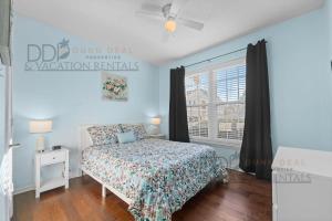 a bedroom with a bed and a window at Legacy Villa 1501 in Gulfport +17 photos