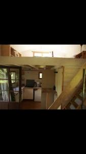 a view of a kitchen and a living room at Cabane en bois in Saint-Antonin-Noble-Val +2 photos