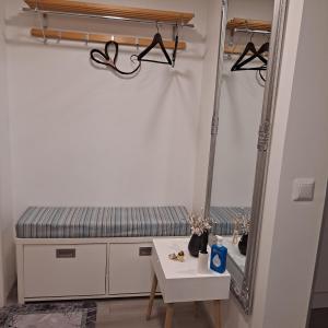 a dressing room with a mirror and a table at Niittytie Alexsandra in Kuopio