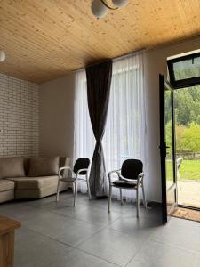 a living room with chairs and a couch and a window at Khedi Utsera in Utsera +46 photos