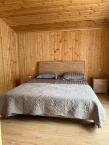 a bedroom with a bed with two pillows on it at Khedi Utsera in Utsera