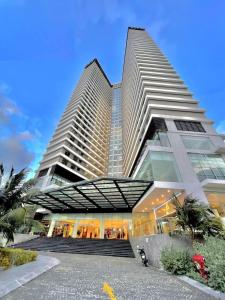 a large building with two tall buildings at FLC Sea Tower- Quy Nhon Beach in Quy Nhon