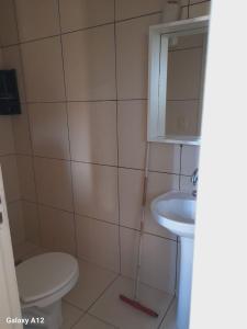 Ένα μπάνιο στο Apartamento conjugado em Tramandai