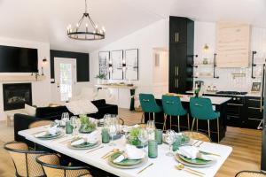 a dining room and living room with a table and chairs at Oak & Ember Lodge in Mount Jackson