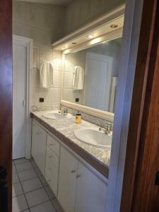 a bathroom with two sinks and a large mirror at Can Marisu, Casita privada in Cabrils +29 photos