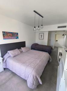 a bedroom with a large bed in a room at BA Departamentos Microcentro 4 in Buenos Aires +23 photos