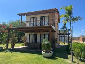 a house with a table in front of it at Casa Aloha in Petrolina