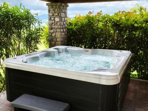 a hot tub sitting on a patio at Villa Dol in Buzet