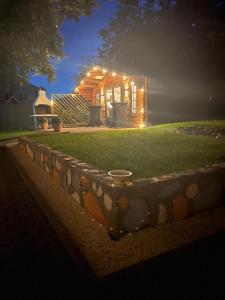 a small house with lights on it in the yard at Smart sleep in Watrange